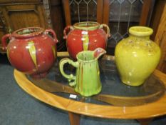A PAIR OF GLAZED TWIN HANDLED VASES H 31 CM TOGETHER WITH ANOTHER SIMILAR JUG AND ANOTHER VASE (4)