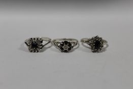 THREE GEM SET SILVER DRESS RINGS