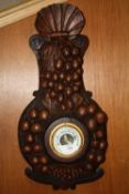 A HEAVILY CARVED OAK WALL BAROMETER WITH GRAPE DETAIL, H 54 CM