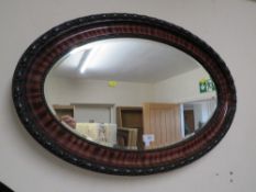 A VINTAGE OVAL WALL MIRROR W-82 CM WITH A NEST OF TABLES