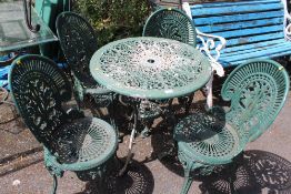 A CAST GARDEN TABLE AND 4 CHAIRS - A/F