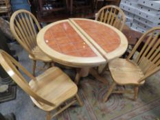 A MODERN KITCHEN EXTENDING TABLE AND FOUR CHAIRS