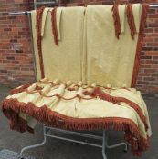 A PAIR OF INTERLINED GOLD CURTAINS WITH CONTRASTING TASSEL EMBELLISHMENT AND MATCHING TIE BACK'S,