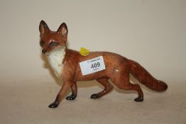 A BESWICK STANDING FOX FIGURE