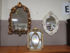 A CONTEMPORARY GILT ARCHED WALL MIRROR H-68 W-48 CM TOGETHER WITH TWO MORE DECORATIVE MIRRORS (3)