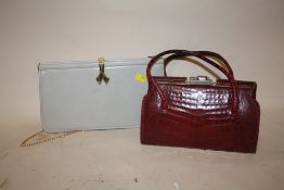 A VINTAGE RED CROCODILE SKIN EFFECT HANDBAG, TOGETHER WITH A GREY LEATHER EVENING BAG