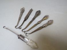 A COLLECTION OF SILVER MINIATURE BUTTON HOOKS, various makers and hallmarks, comprising silver