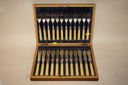 A MAHOGANY CASED CANTEEN OF FISH KNIVES AND FORKS