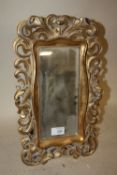 A MODERN EASEL-BACK TABLE TOP MIRROR WITH GILT PIERCED FRAME, OVERALL H. 41 CM, W. 25 CM