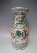 AN ANTIQUE ORIENTAL PORCELAIN BALUSTER VASE, with twin fish handles, floral decoration throughout