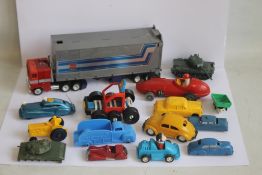 A VINTAGE OPTIMUS PRIME TRANSFORMER, three vintage metal cars including two American made and ten