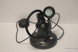 AN ANGLE POISED LAMP