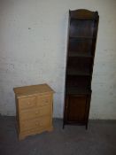 A NARROW OAK BOOKSHELF AND A FOUR DRAWER CHEST OF DRAWERS, two over two with contents