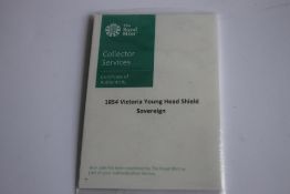 A VICTORIAN 1854 SHIELD BACK SOVEREIGN IN ROYAL MINT COLLECTORS SERVICES PACKET