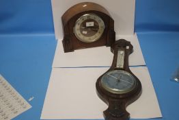 AN OAK MANTEL CLOCK AND A BAROMETER
