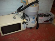 A HOOVER WET & DRY AQUAMASTER, A PANASONIC MICROWAVE, A BOXED AEG RAPID CLEAN STAIR AND CAR HOOVER