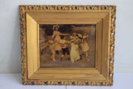A FRAMED AND GLAZED CHRYSTOLEUM, depicting children doing ring of roses 39 x 33 cm