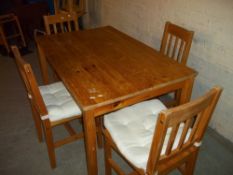 A PINE DINING SET WITH FOUR CHAIRS