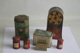 A 'JACOB & CO.' BISCUIT TIN MONEY BOX with spinning wheel of fortune game and Christmas scenes on
