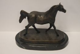 A BRONZE STYLE HORSE ON PLINTH