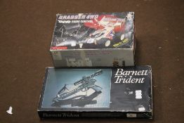 A BOXED CROSSBOW AND A BOXED REMOTE CONTROL CAR