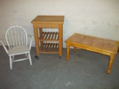 THREE ITEMS COMPRISING A WHITE PAINTED CHAIR IN THE STYLE OF ERCOL, A TILE TOPPED COFFEE TABLE AND A