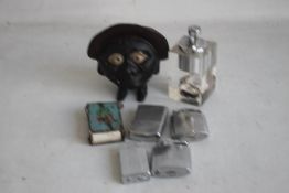 A VINTAGE SAVE AND SMILE MONEY BOX, and a quantity of cigarette lighters