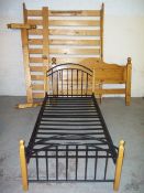 A KING SIZE BED FRAME (BOLTS MISSING) AND A SINGLE METAL FRAME BED