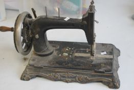 A J.G GRAVES OF SHEFFIELD SEWING MACHINE, Black painted with gilt detail
