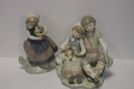 A LLADRO FIGURE GROUP together with a LLadro figurine