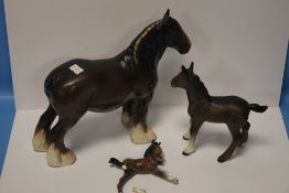 A BESWICK SHIRE HORSE together with two Beswick foals (one A/F)