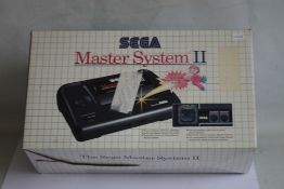 A BOXED SEGA MASTER SYSTEM II, with instuctions