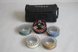 A GREYS GRXI+ 7/8 CARTRIDGE SPOOL FLY REEL and four spare spools not marked in zipped padded pouch¦