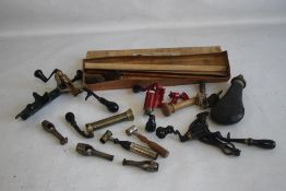 A BOX CONTAINING A VINTAGE SHOTGUN CARTRIDGE SHELL, Webley gun cleaning kit etc
