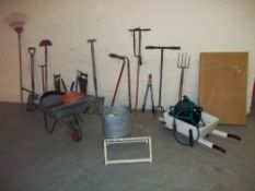 A SELECTION OF GARDEN TOOLS INCLUDING A WHEELBARROW ETC.