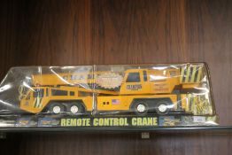 A CHAMPION REMOTE CONTROL CRANE IN ORIGINAL PACKAGING