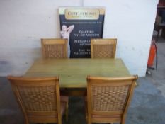 A MODERN DINING TABLE AND FOUR CHAIRS