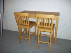 A HIGH BENCH DINING TABLE AND TWO TALL CHAIRS