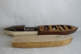 THREE VINTAGE FIBRE GLASS AND WOOD BOATS AND STANDS, 76 cm, 63 cn, and 90 cm