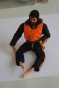 A VINTAGE ACTION MAN EAGLE EYES FIGURE WITH DARK FLOCK HAIR AND BEARD, in flying suit and USAF