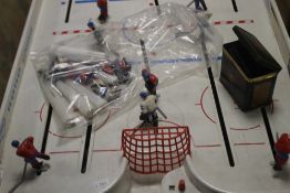 A TABLE TOP ICE HOCKEY GAME TOGETHER WITH A BOXED MICRO SUPER ENDURANCE SCALEXTRIC