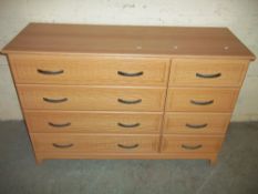 A SIX DRAWER WIDE CHEST OF DRAWERS
