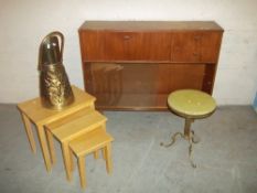 A TEAK BOOKCASE, A BRASS COAL SCUTTLE, A MODERN NEST OF THREE TABLES AND A MARBLE TOPPED BRASS