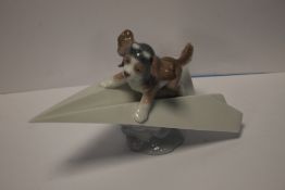 A LLADRO DOG ON AEROPLANE