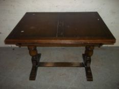 AN OAK VINTAGE DRAWER LEAF TABLE