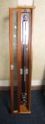 A STICK BAROMETER, F. D. & Co., Watford in a mahogany case