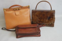 A VINTAGE LEATHER HANDBAG with metal clasps, no maker's labels together with a Katana of Paris