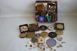 A BOX OF CURIOS, to include 16 compacts, enamel pin badges, pen knives, compass etc