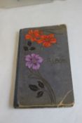 AN EDWARDIAN POSTCARD ALBUM AND CONTENTS (INSCRIPTION TO THE INSIDE OF THE FRONT COVER),
