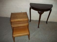 A VINTAGE HALF MOON HALL TABLE WITH CABRIOLE LEGS AND A TEAK NEST OF TABLES